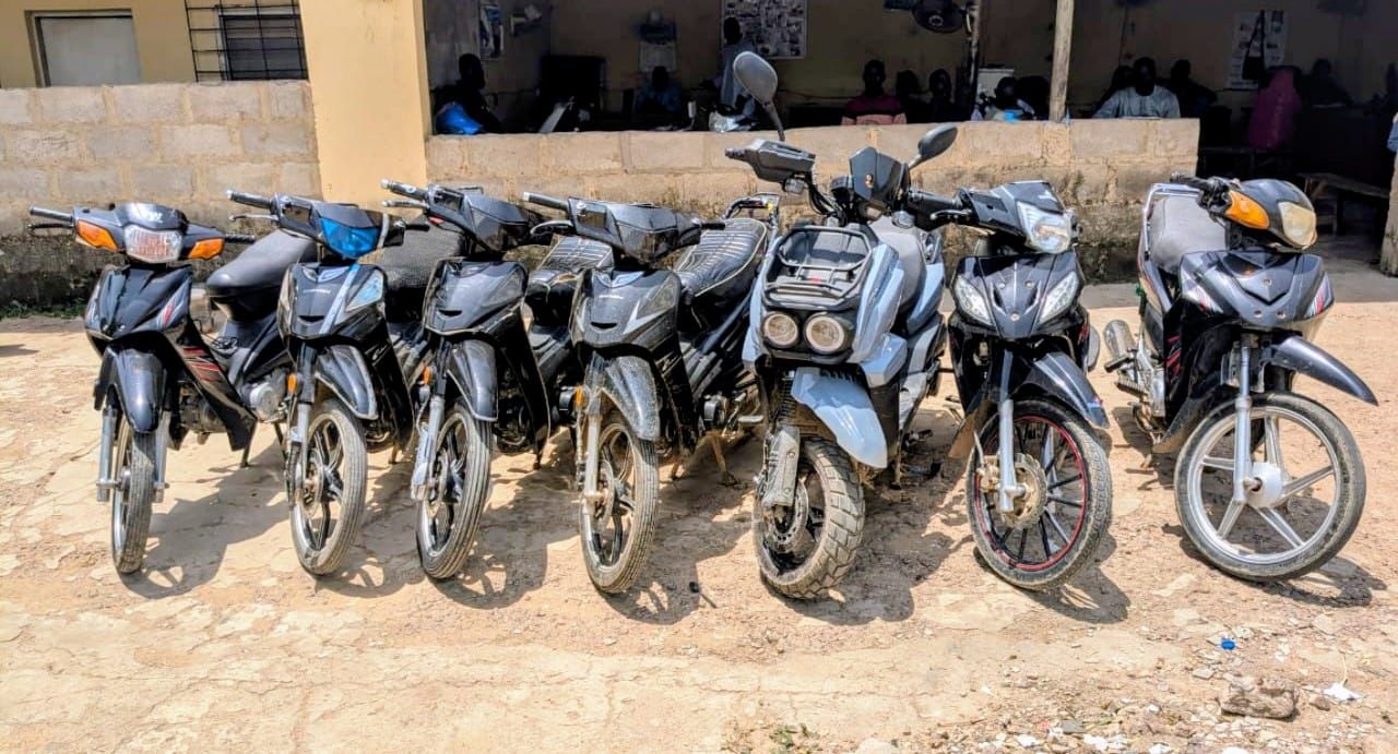 Police officers with recovered motorcycles