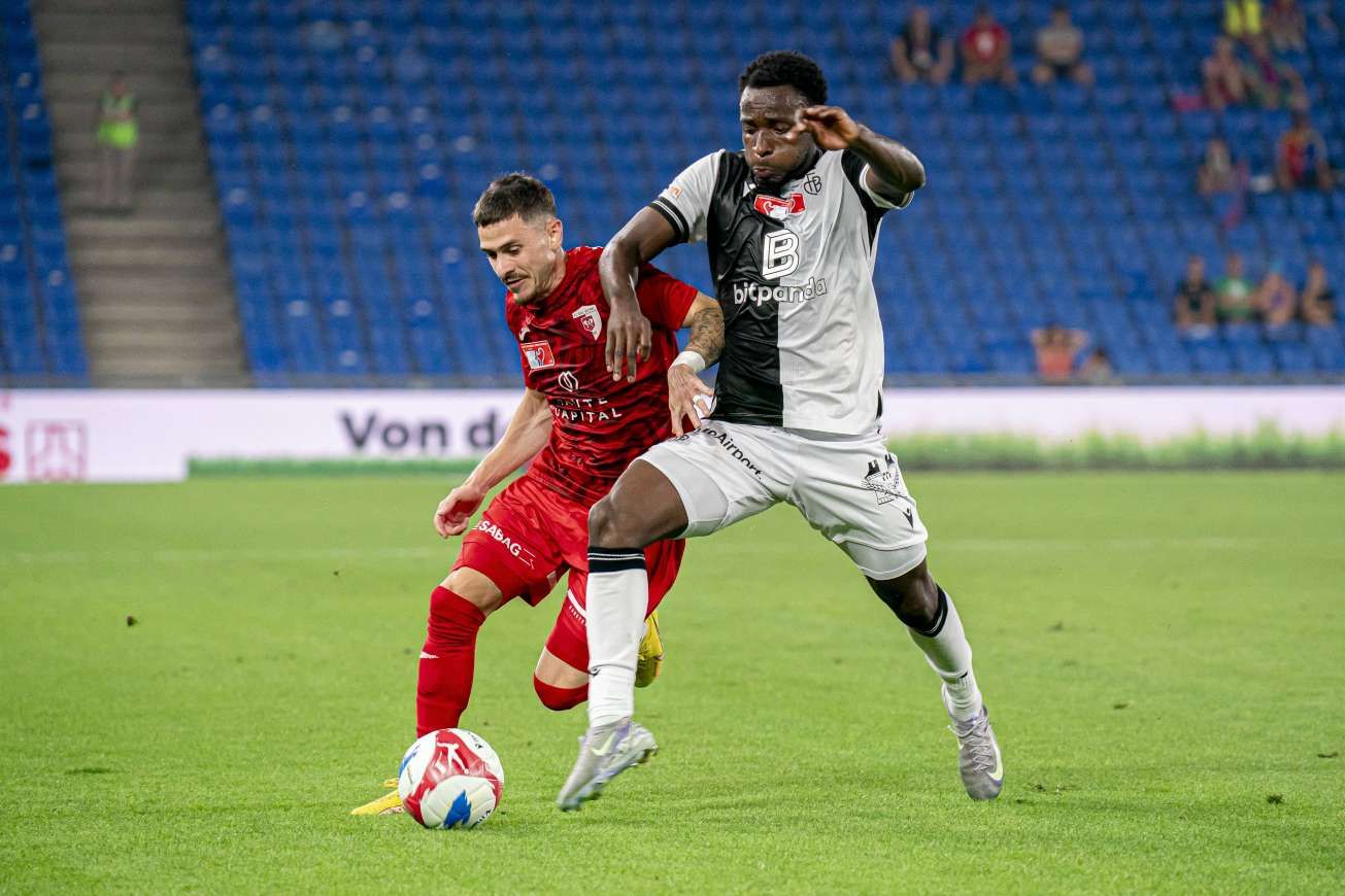 Philip Otele challenges an opponent