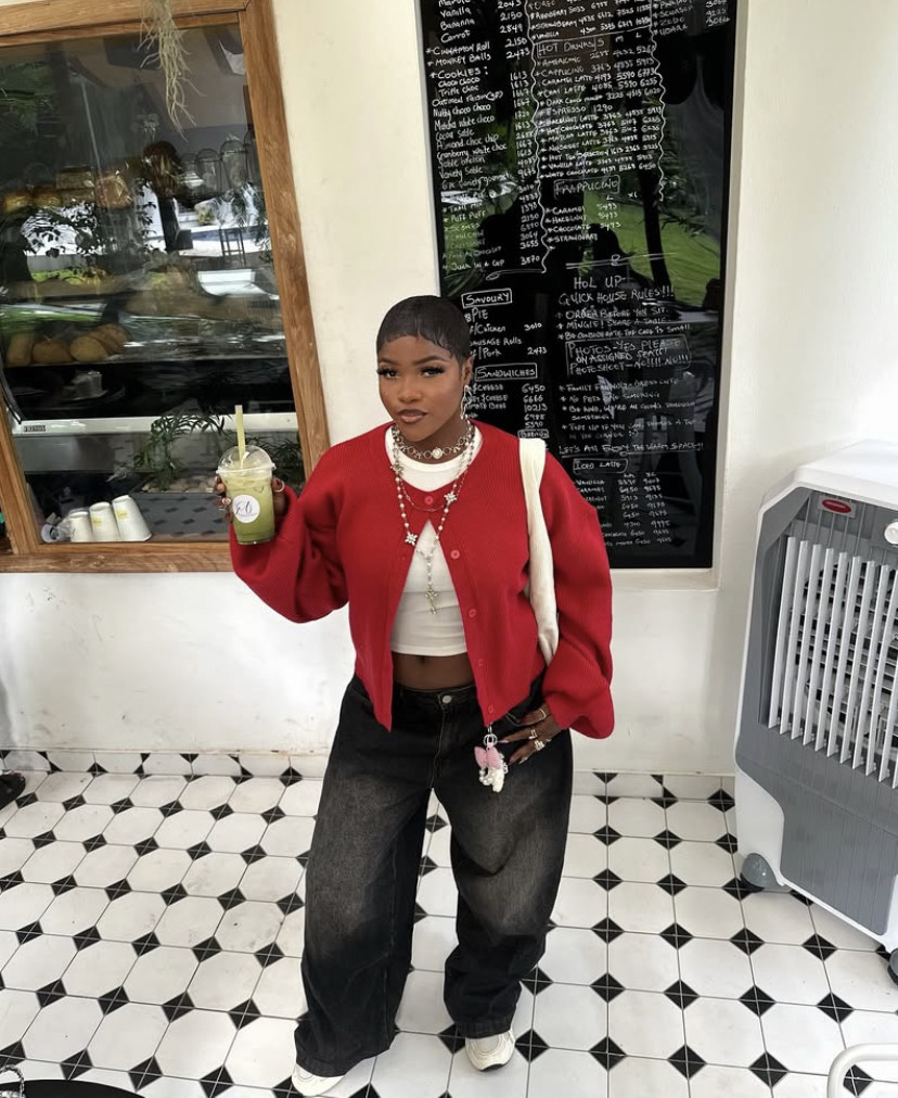 Model in cardigan over white tank