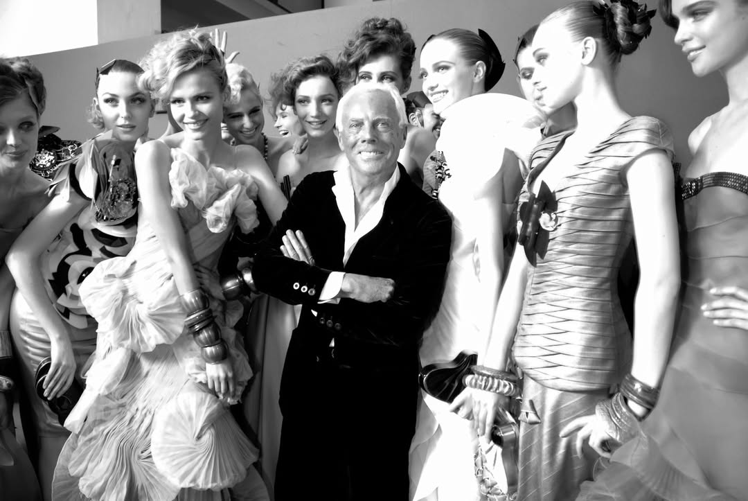Giorgio Armani with models backstage.