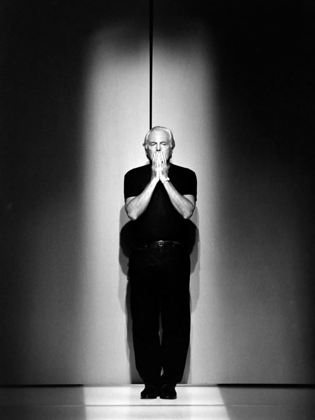 Giorgio Armani in his later years, celebrated as an Italian fashion icon.