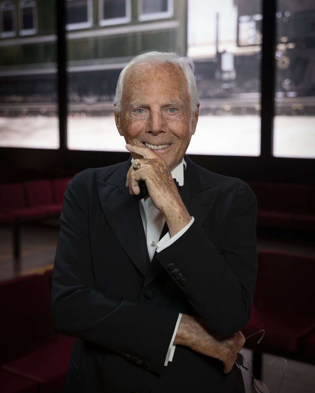 Giorgio Armani in his later years, celebrated as an Italian fashion icon.