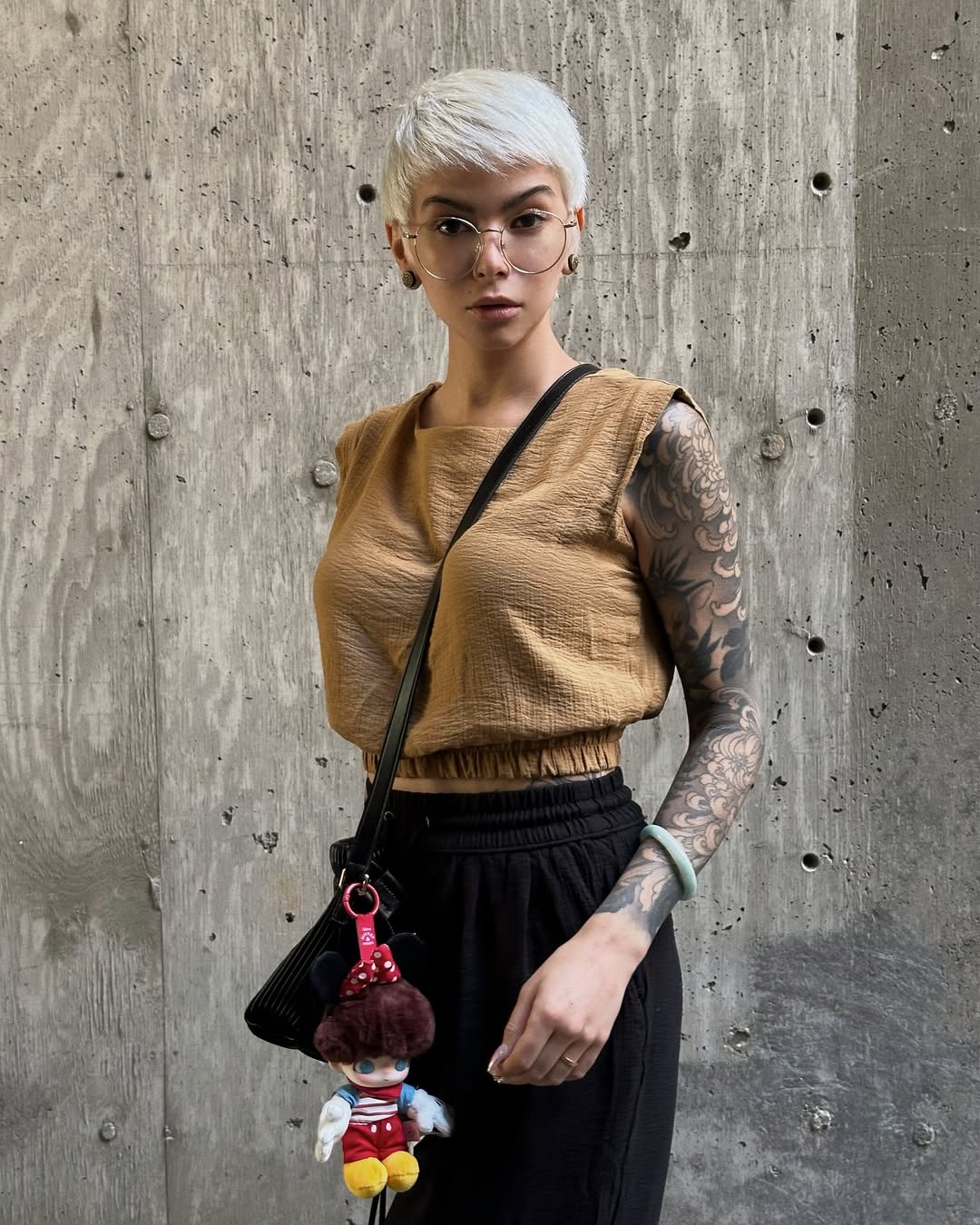 bag charm adding playful detail to fall streetwear