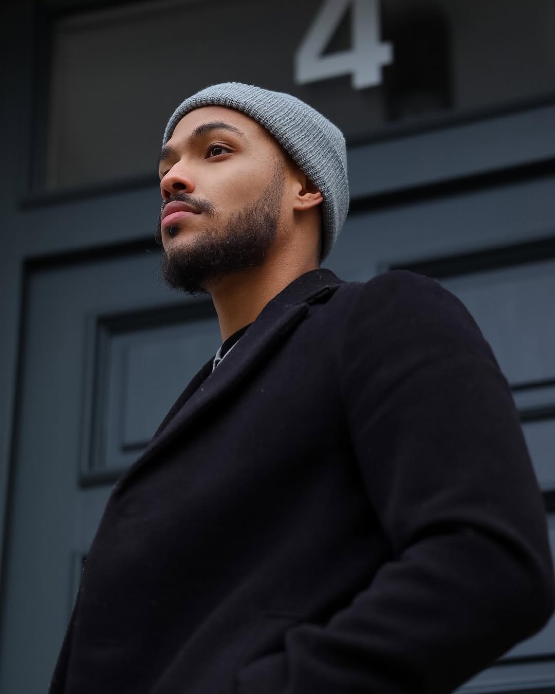 Cozy men's fall look showing how to wear beanies with layered outerwear
