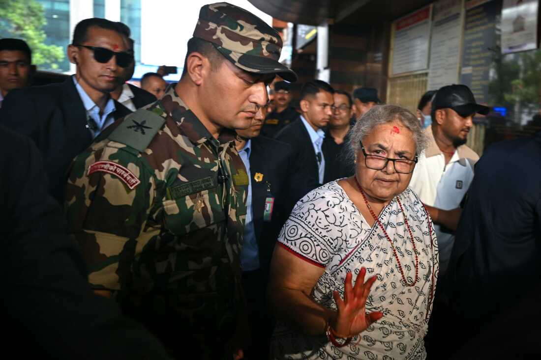 Nepal's interim Prime Minister Sushila Karki visits the National Trauma Center hospital to meet those injured during clashes with security forces in Kathmandu on September 13.