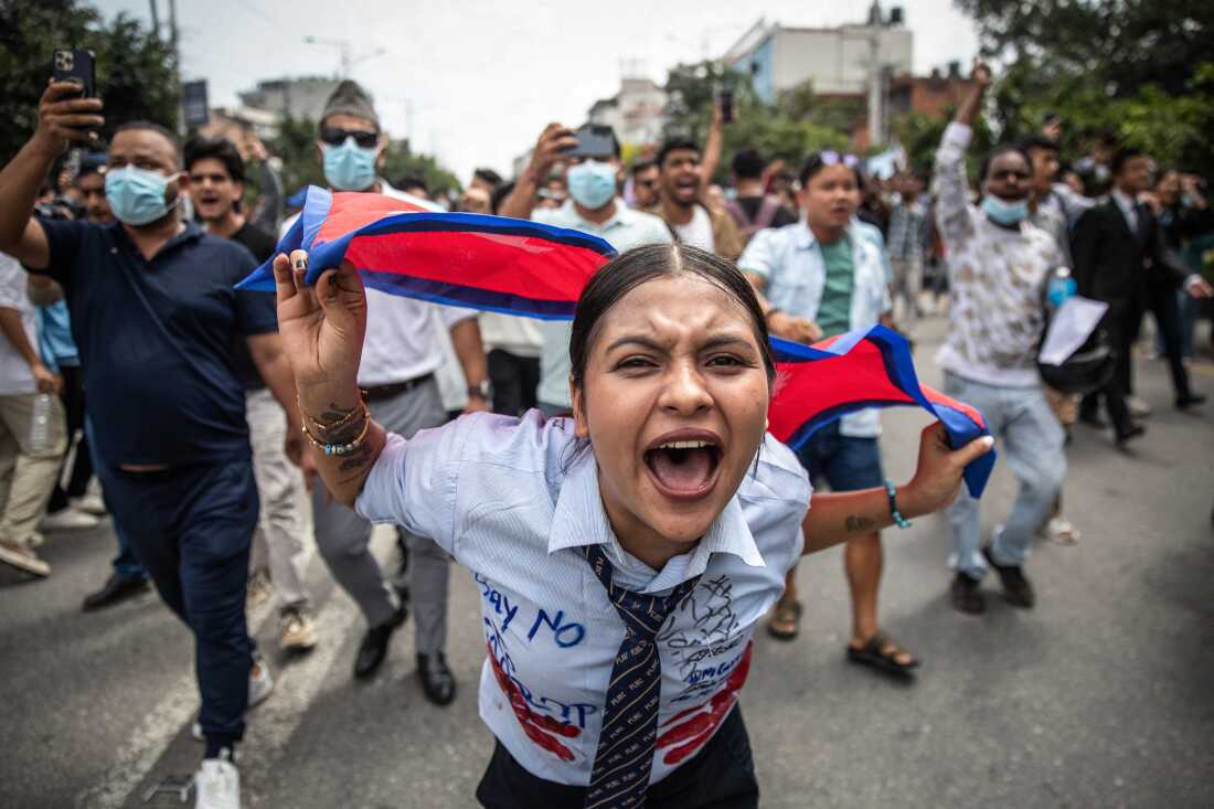 A protester chants slogans outside Nepal's Parliament in Kathmandu on September 8.