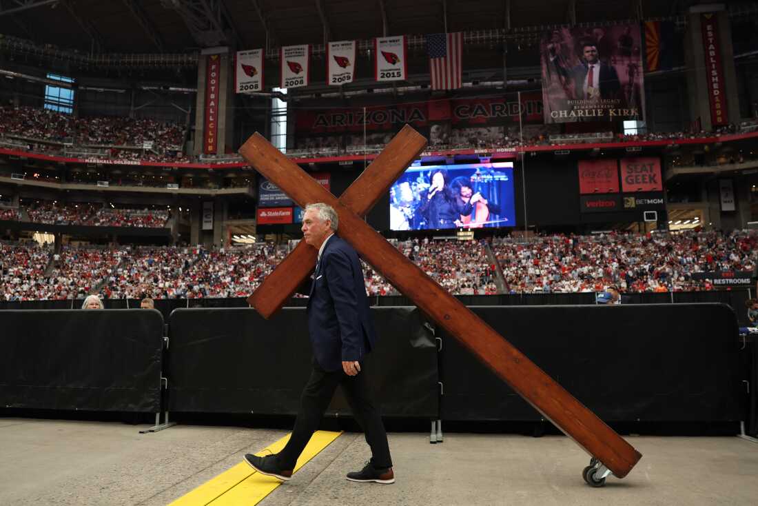 Large cross being brought in before Charlie Kirk's memorial service