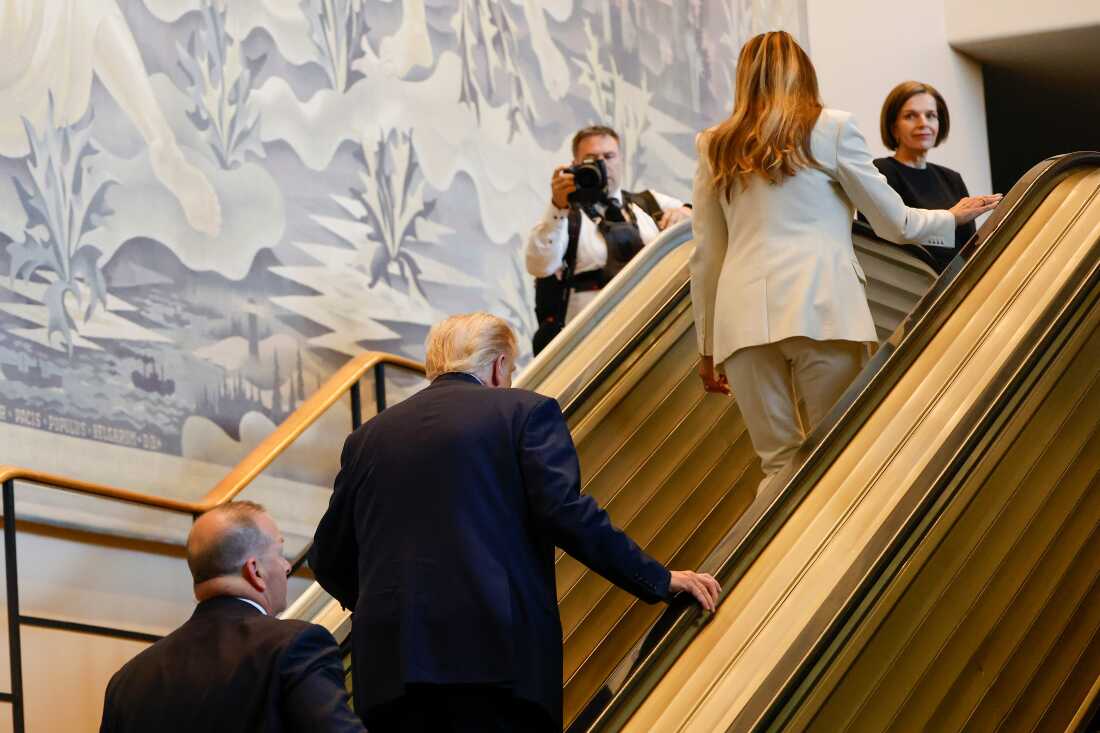 President Trump and First Lady Melania Trump walking up the stalled escalator at the U.N.