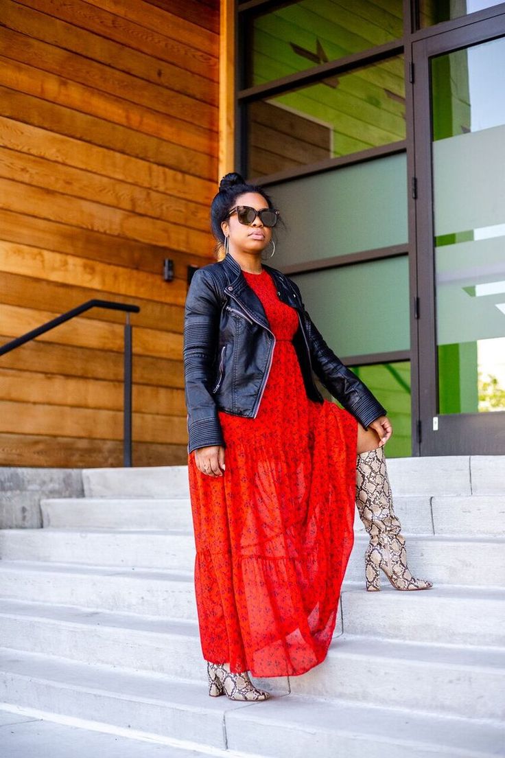 woman wearing flowy dress with snakeskin boots