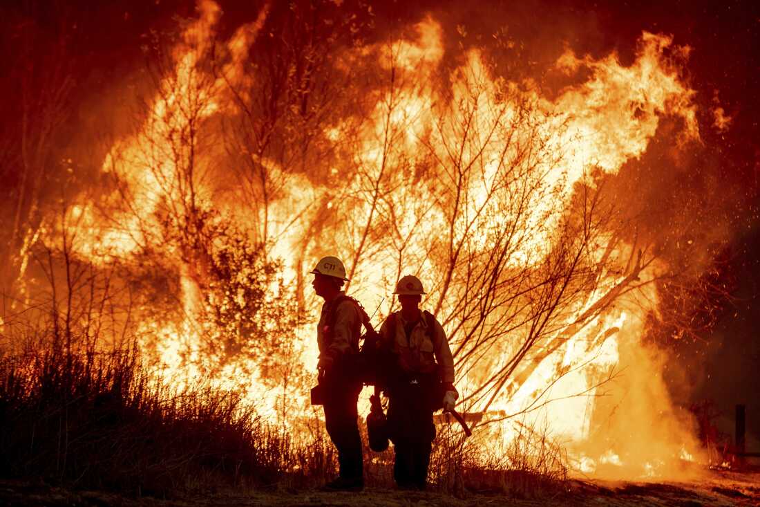 FILE - Fire crews battle the Kenneth Fire in the West Hills section of Los Angeles, Thursday, Jan. 9, 2025.
