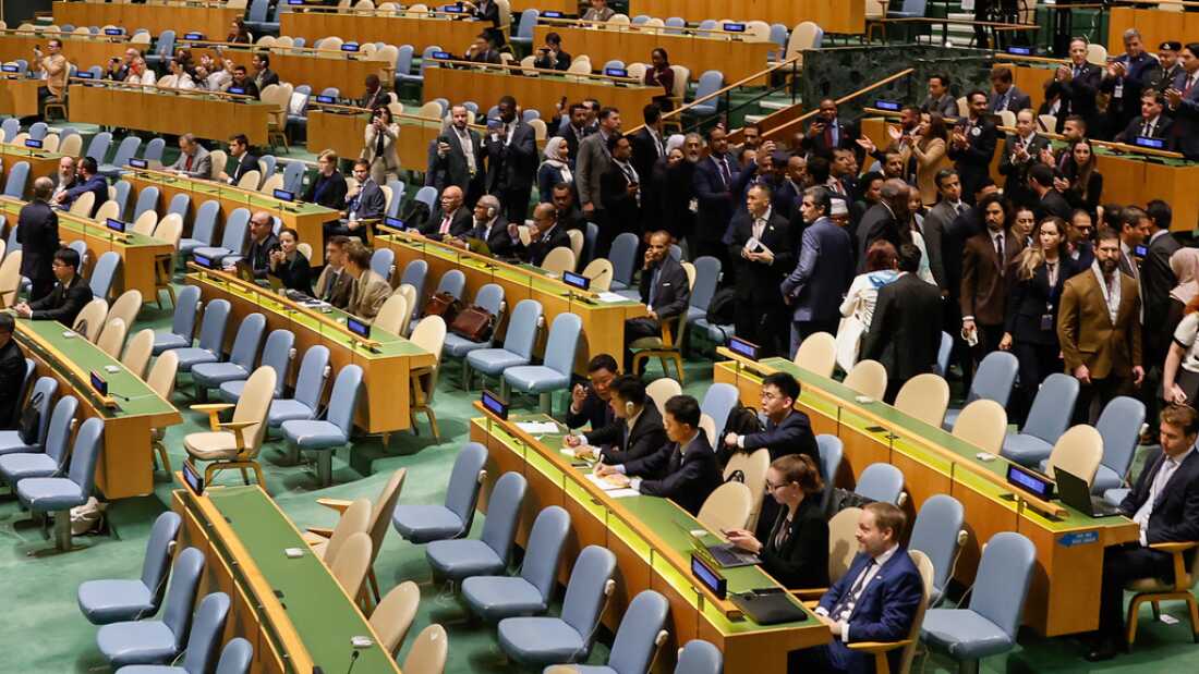 Delegates exiting the General Assembly hall as Netanyahu approaches the podium at the 80th U.N. General Assembly session.