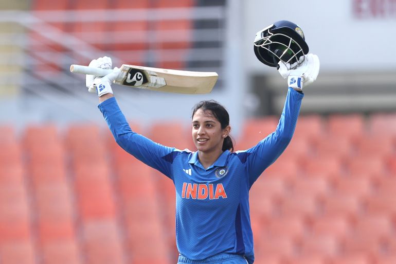 CHANDIGARH, INDIA - SEPTEMBER 17: Smriti Mandhana of India celebrates after scoring a hundred during game two of the Women's ODI series between India and Australia at Maharaja Yadavindra Singh International Cricket Stadium on September 17, 2025 in Chandigarh, India. (Photo by Pankaj Nangia/Getty Images)