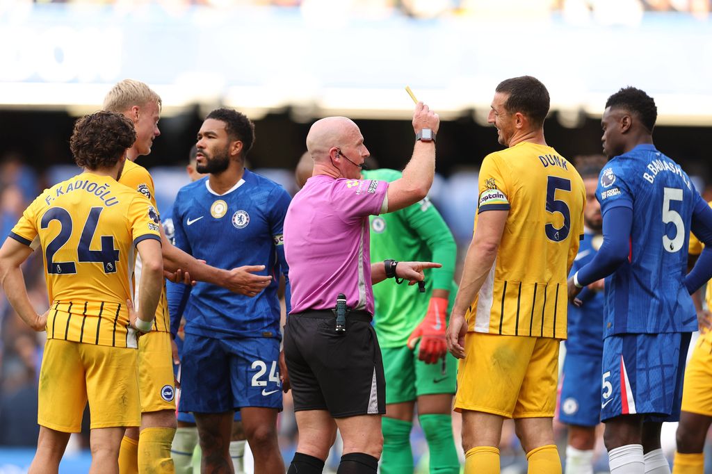 Chelsea's Benoit Badiashile receives a <a href=