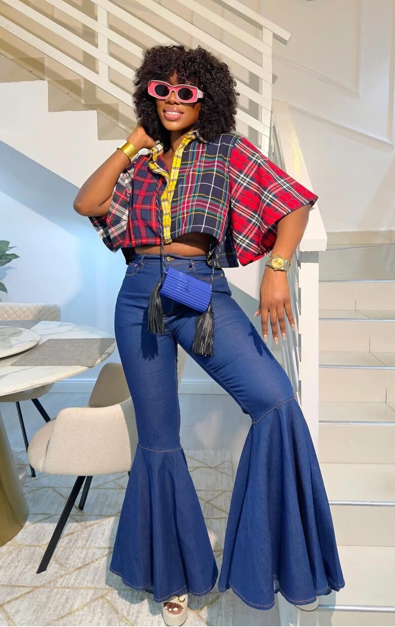woman in flare jeans with eclectic top