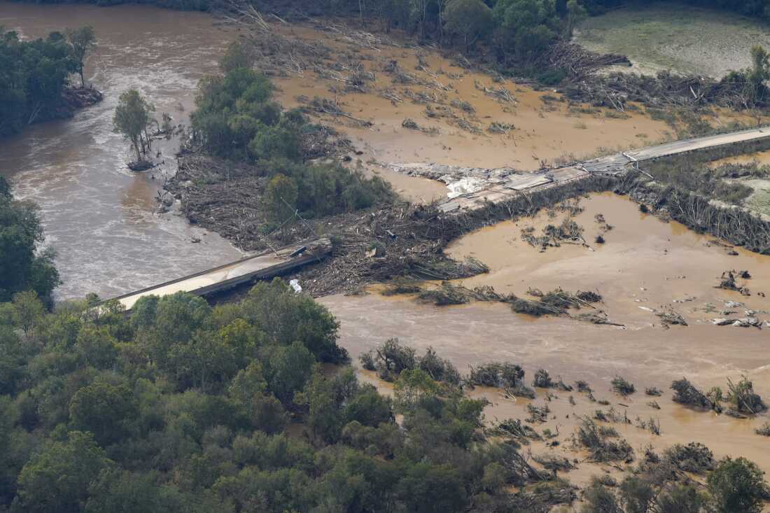 An aerial view of a damaged bridge and flooding in the aftermath of Hurricane Helene is seen along the Nolichucky River, Sept. 28, 2024, in Greene County, Tenn.