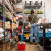 A family collects groceries at a community pantry in Austin, Texas, on March 26.