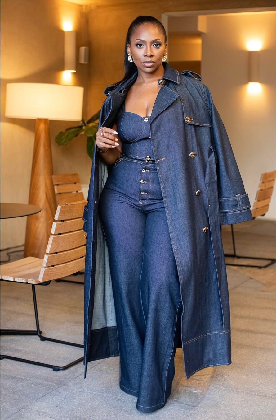 woman wearing flare jeans with denim corset and denim coat