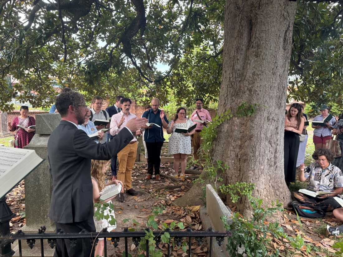 Jesse Karlsberg leading a Sacred Harp hymn at the grave of Benjamin Franklin White in Atlanta's Oakland Cemetery.