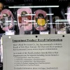 Recall notice for listeria contamination displayed in a Safeway store.