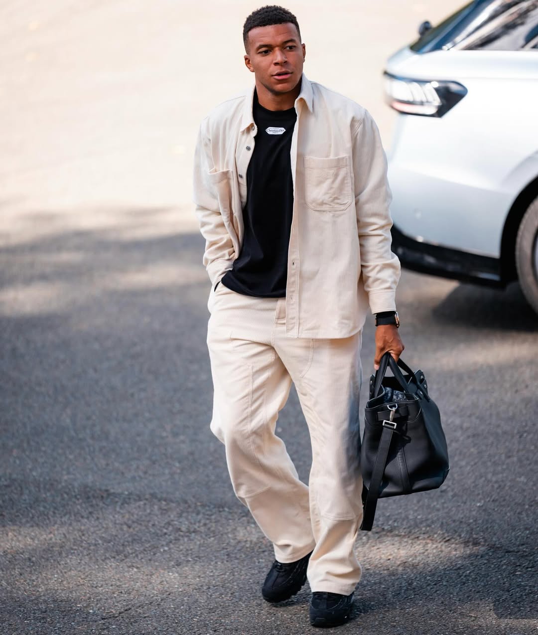 mbappe wearing white men's chore jacket