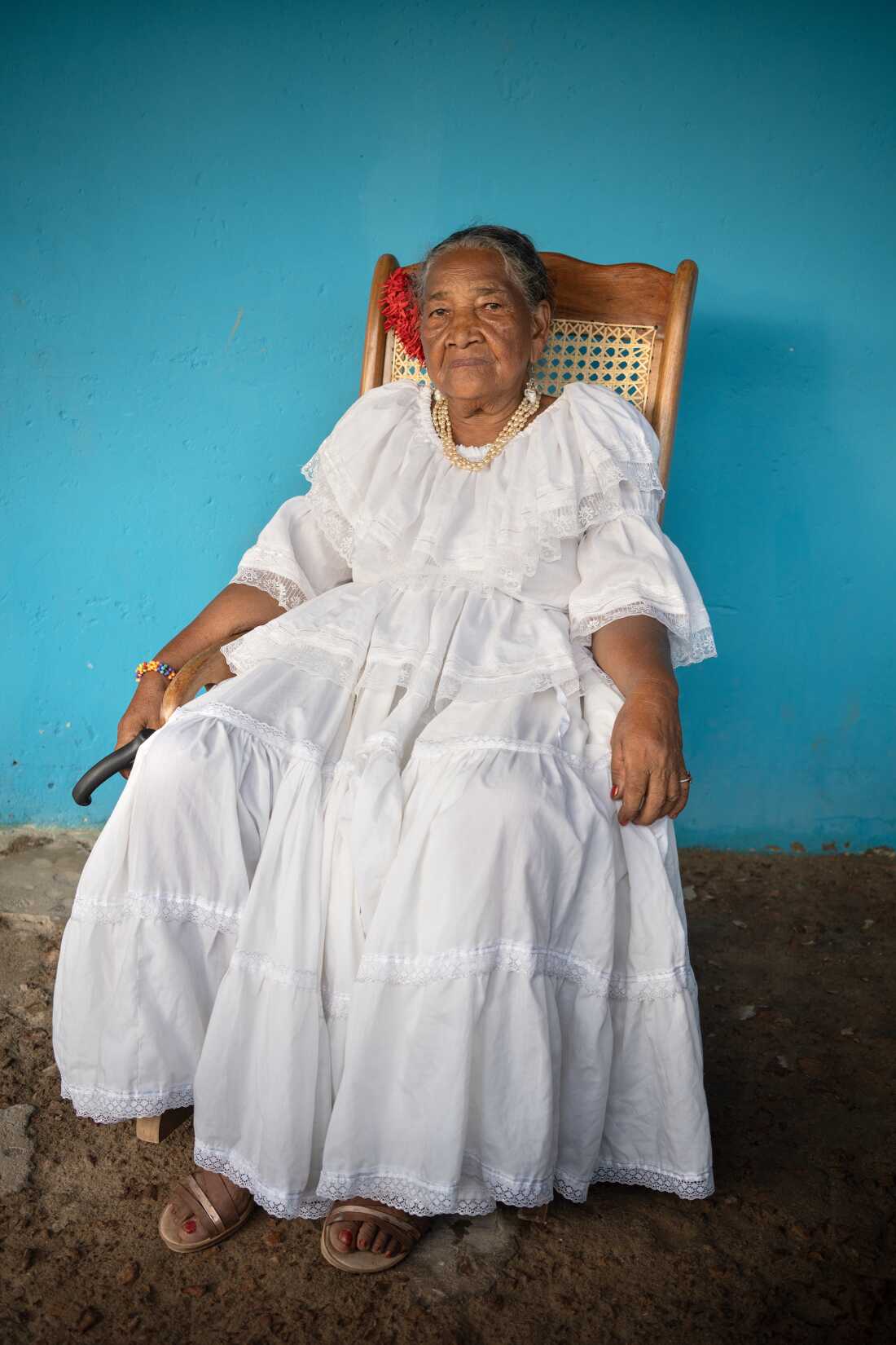 Ana Regina Ardila Matos poses in her hometown of San Martín de Loba, Bolívar, Colombia, on August 5, 2022. She is a cantadora of tambora, a rhythm closely related to cumbia, using the same instruments. Ardila comes from a lineage of women who compose songs about daily life, passed down orally. Many cantadoras in the region have grown up amid poverty, conflict, and displacement.