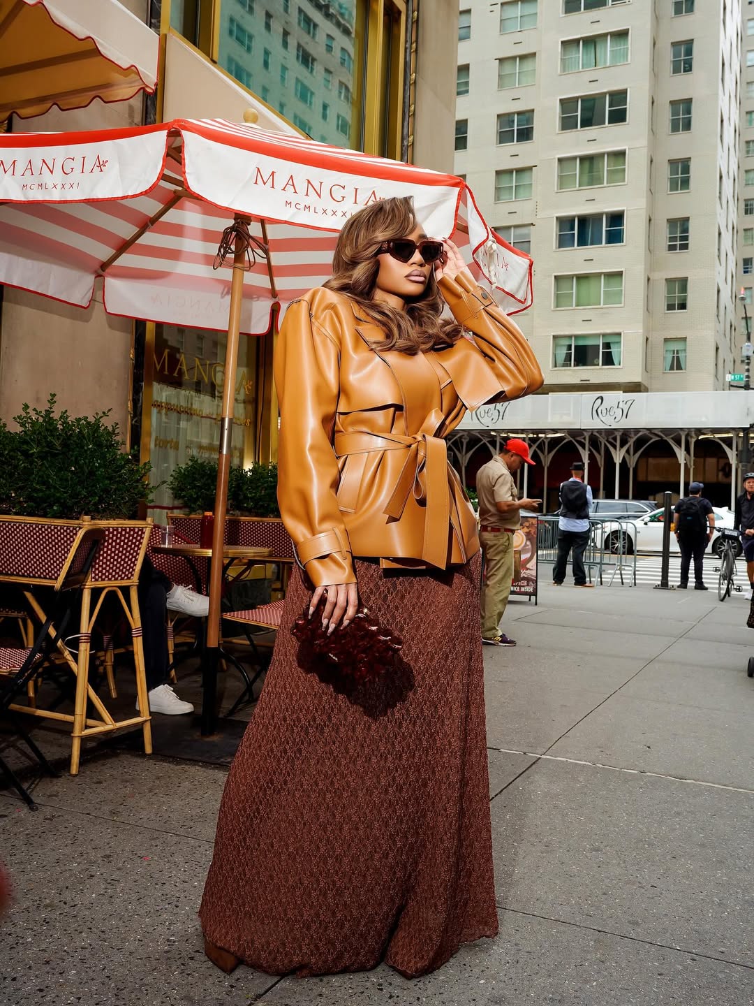 woman wearing brown maxi dress with fall leather jacket