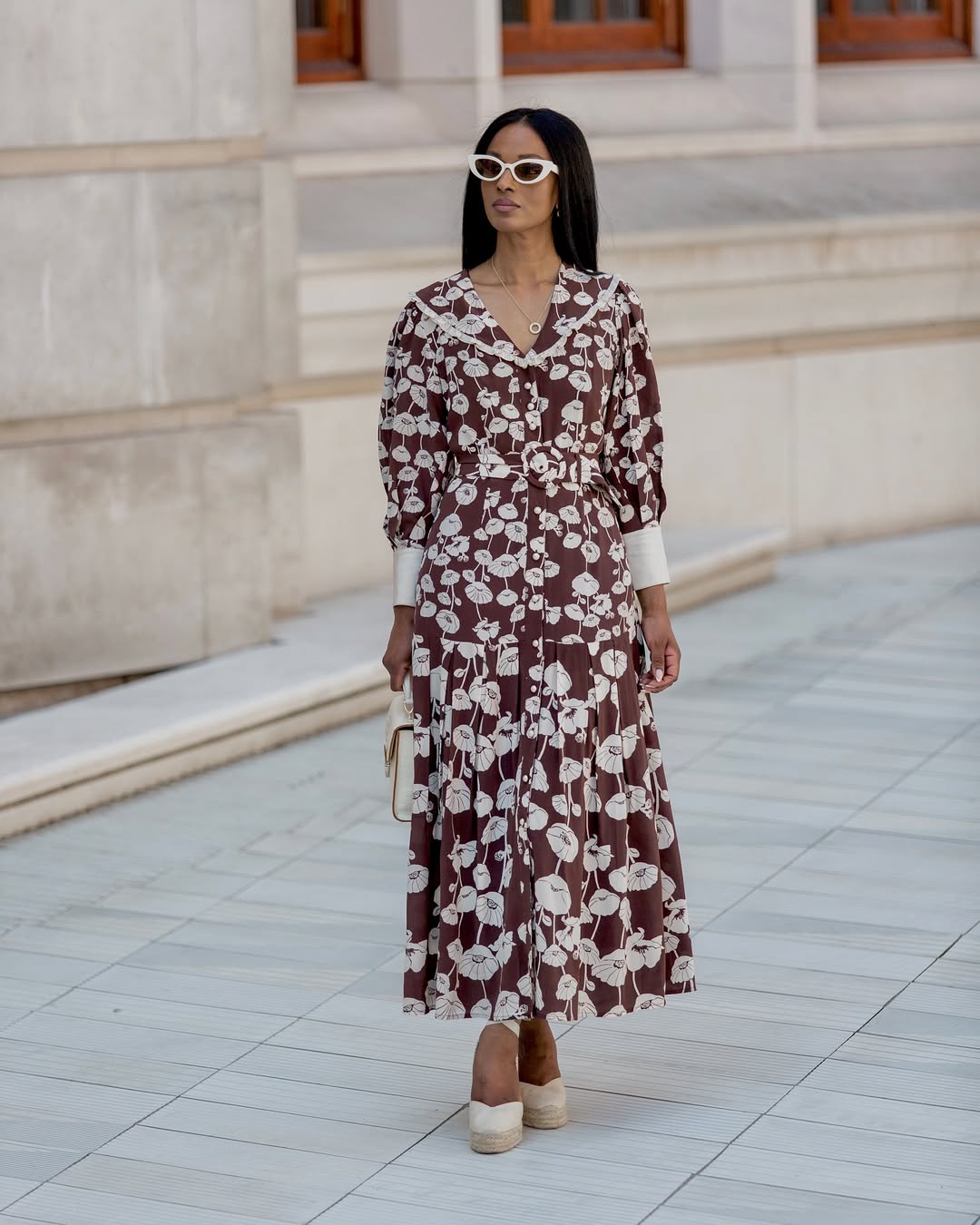 woman wearing printed brown and white dress