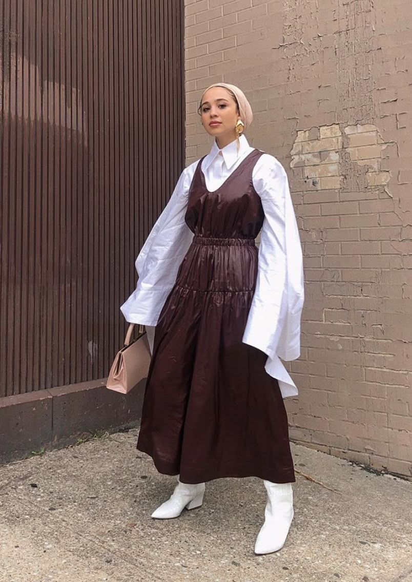 woman wearing midi dress with button-down shirt