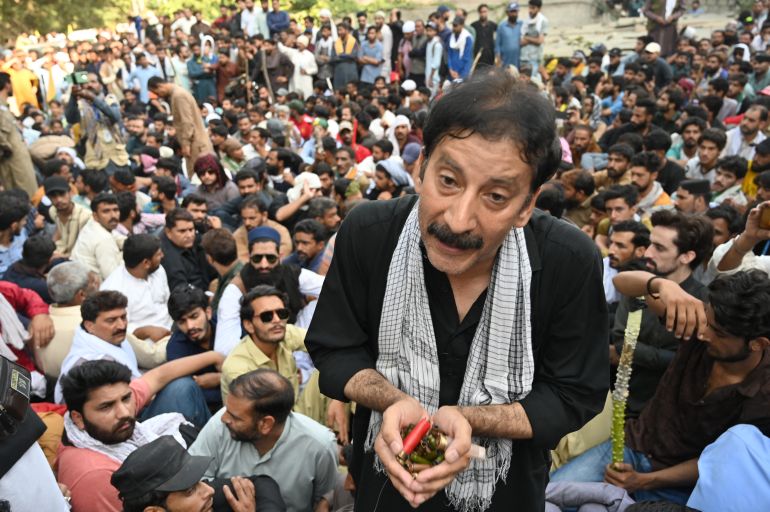 Shaukat Nawaz Mir displays bullets allegedly fired by police during a protest in Muzaffarabad, Pakistan-administered Kashmir, October 1, 2025.