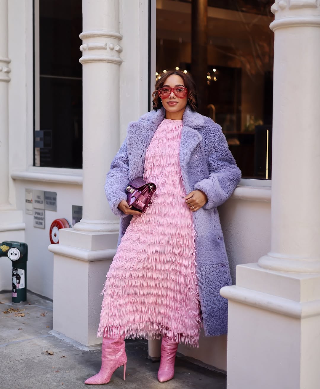 woman wearing tiered modest dress with fur coat