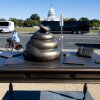 Bronze sculpture of a pile of feces on Nancy Pelosi's desk on the National Mall