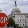 A stop sign in front of the U.S. Capitol in Washington, D.C.