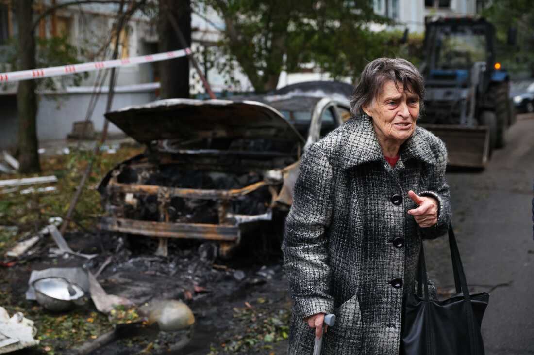 An elderly woman stands beside a home destroyed by a Russian strike in Zaporizhzhia, Ukraine, October 5, 2025.