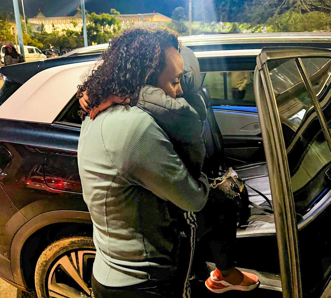 Tsion Firew reunited with her family at Kigali airport after six weeks apart.