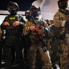 Federal agents including Homeland Security and Border Patrol personnel managing protesters outside a U.S. Immigration and Customs Enforcement facility in Portland, Oregon.