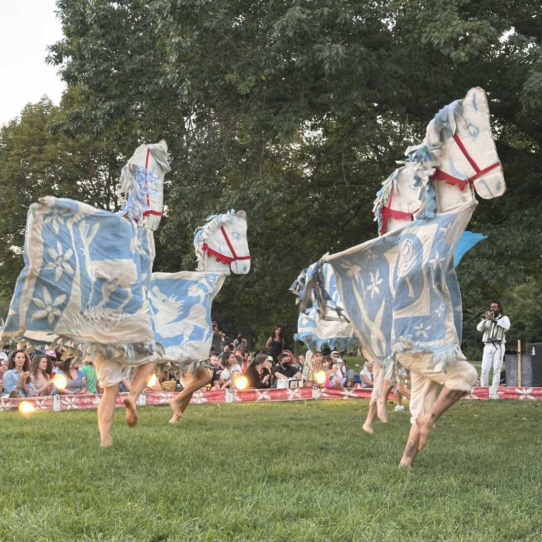 Puppeteers dressed as horses playfully perform during Our Domestic Resurrection Revolution In Progress! in Ypsilanti, Mich.
