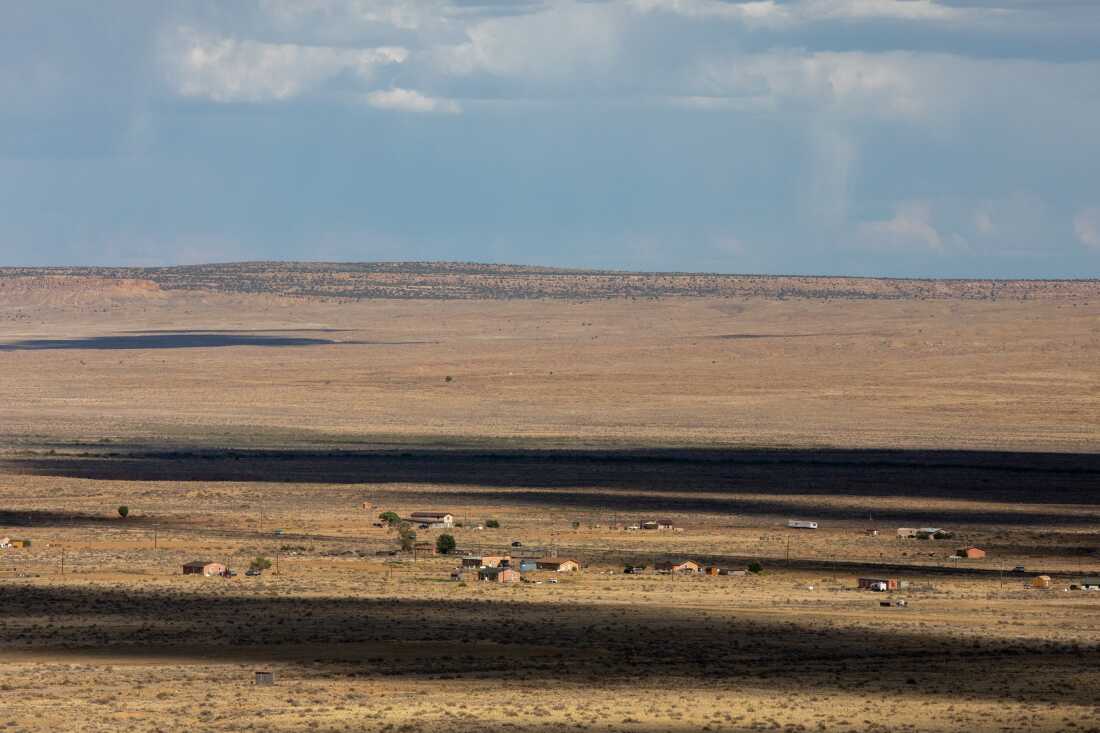 Dry yellow landscape with scattered homes on the Hopi Reservation