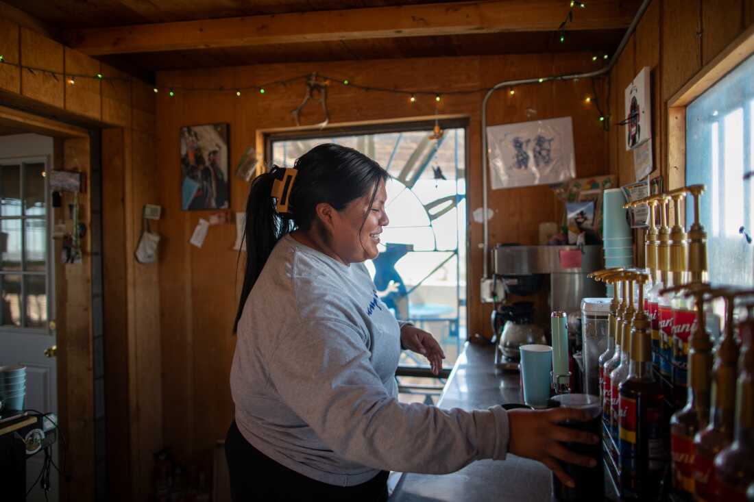 Storm Tso preparing a drink at Hopi Grounds along Route 264