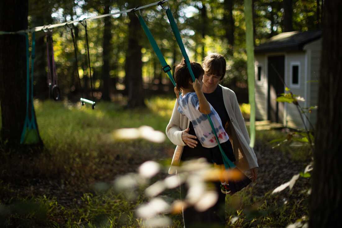 Jenna Norton playing with her son in their backyard.