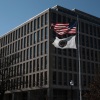 U.S. Education Department building with flags flying in Washington, D.C.