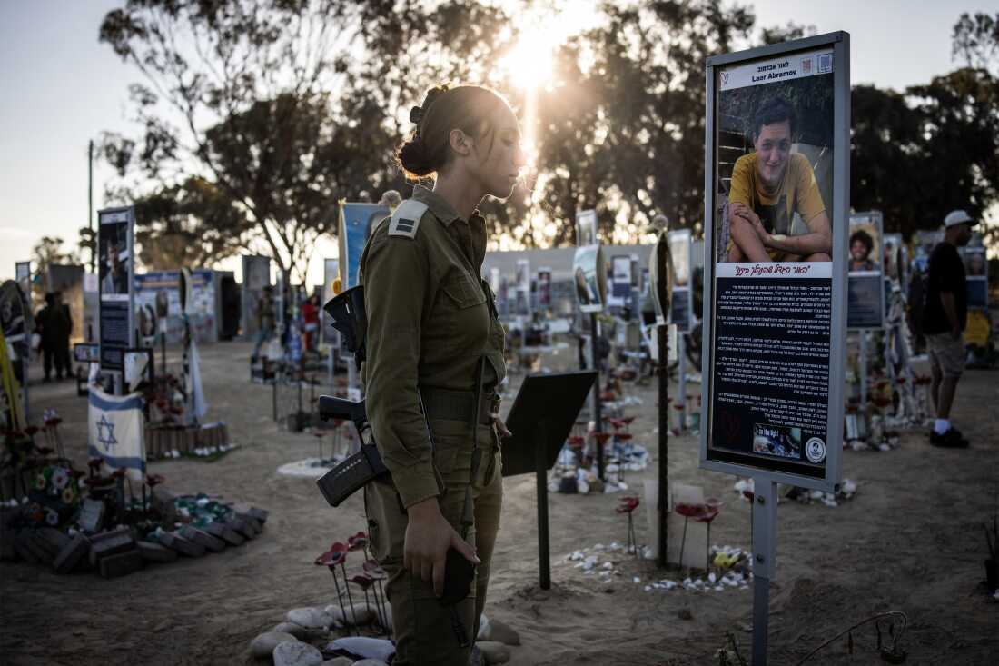 An Israeli soldier stands before a memorial for victims of the October 7, 2023 attacks at the Nova Festival grounds in Reim, southern Israel, on the second anniversary of the attacks.