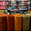 A vendor selling spices at a bustling market in Karachi, June 10, 2025.