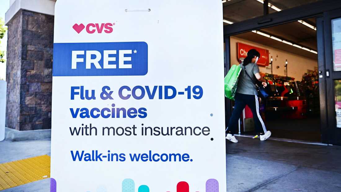 Person entering a CVS store in Monterey Park, California, where flu and COVID-19 vaccines are available.