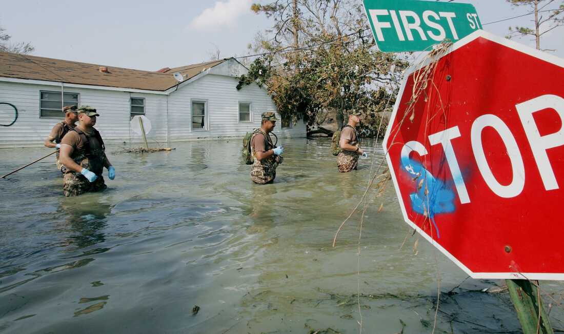 New Mexico National Guard members wading through floodwaters in Port Sulphur, Louisiana, after Hurricane Katrina in 2005