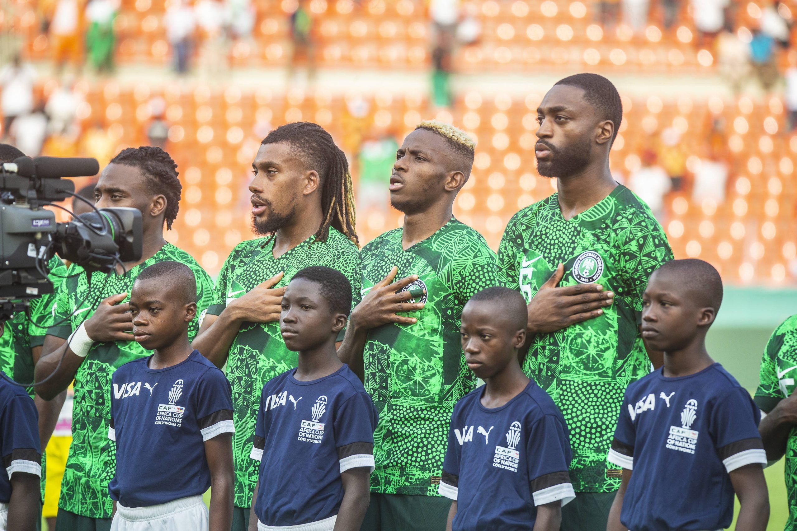 Super Eagles players, Alex Iwobi, Victor Osimhren and Semilore Ajayi during the National Anthem of the game between Nigeria vs South Africa