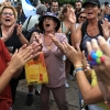 Israelis celebrate as they react to the news of the Gaza peace deal at Hostages Square on Oct. 9, 2025, in Tel Aviv, Israel.