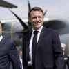 France's President Emmanuel Macron shakes hands with Prime Minister Francois Bayrou during a farewell ceremony in Paris