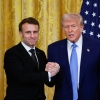 President Trump and French President Emmanuel Macron shake hands at a joint press conference in the White House