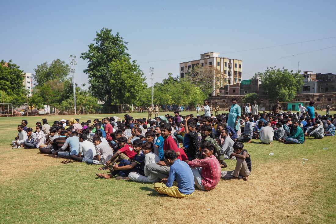 Detained Bangladeshi migrants at a crime branch office in Ahmedabad, India.