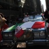 A vehicle adorned with an Italian flag during the annual Columbus Day Parade in New York City, 2023